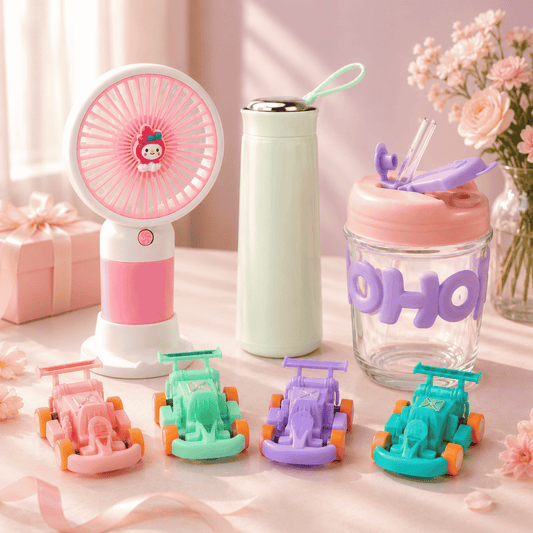 Set of colorful items including a fan, tumbler, and small car toys on a light surface with flowers in the background.